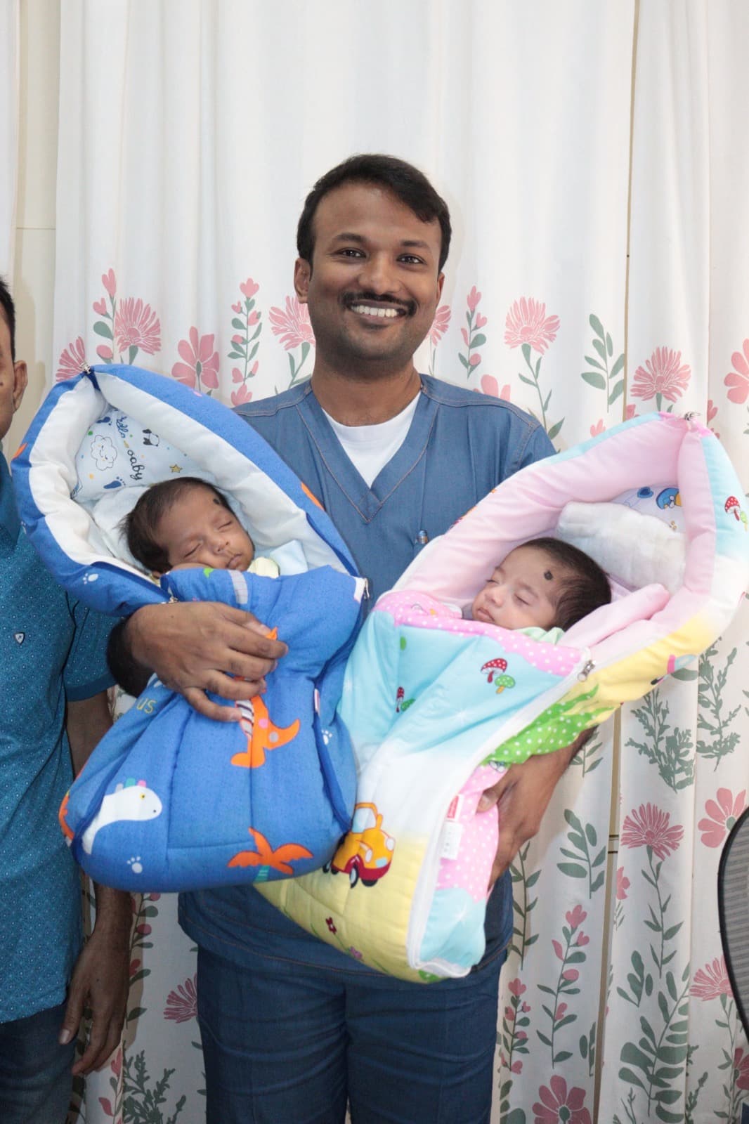 Happy parents with newborn after successful IVF fertility treatment at Iswarya Fertility Centre