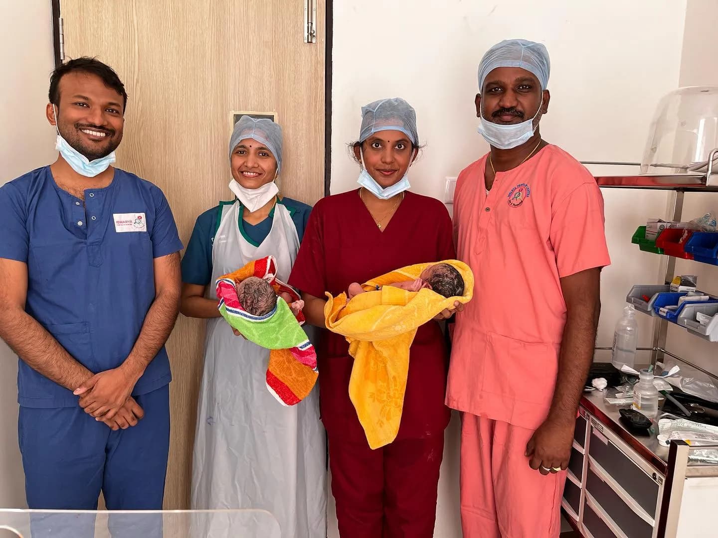 Dr. Arun Muthuvel with medical team and newborn twins delivered through IVF treatment